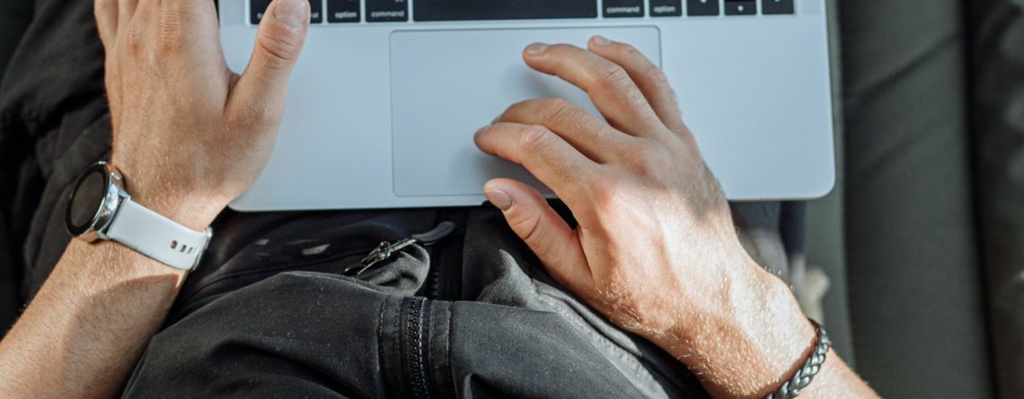 Free A Person Working on His Laptop Stock Photo