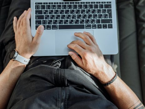 Free A Person Working on His Laptop Stock Photo