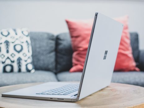 macbook pro on white couch