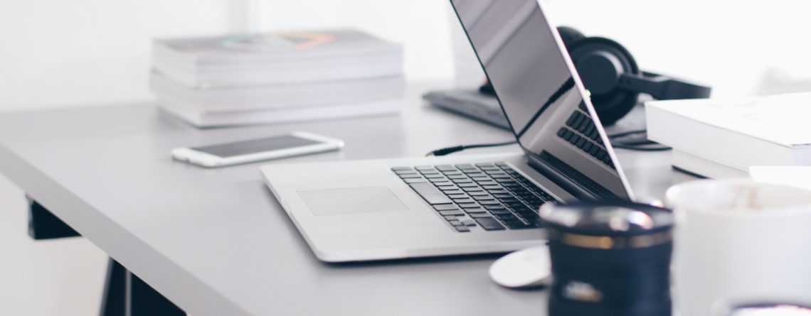 Free Gray Laptop on Table Top Stock Photo